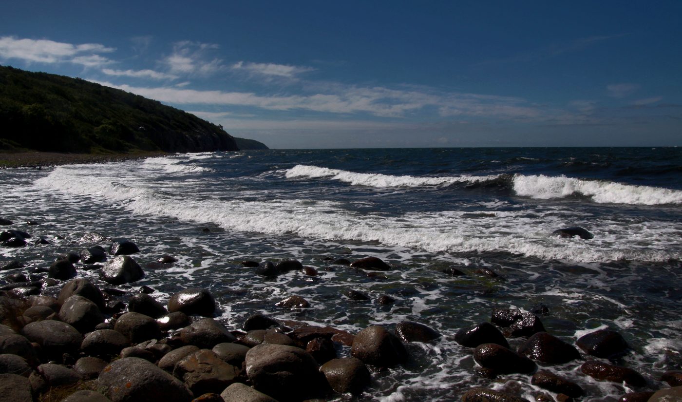 Bornholm Hammeren coast with waves on a pebble beach