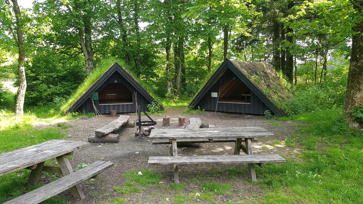 Two wooden shelters numbered 4 and 5 at Kirstinelyst