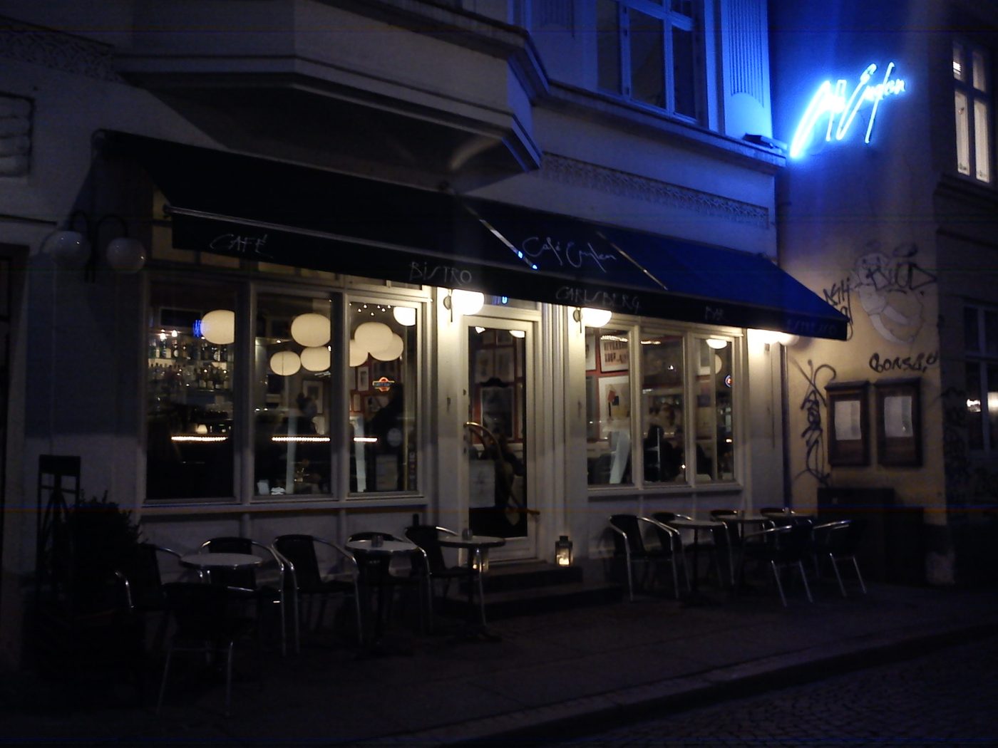 Café in the Aarhus Latin Quarter — outdoor seating along a narrow cobbled street