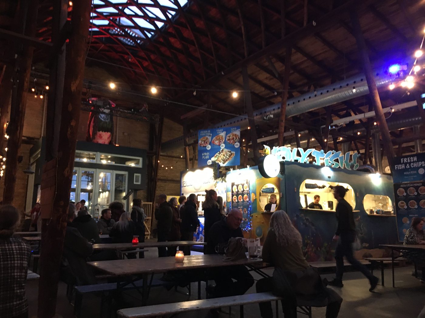 Storms Pakhus food hall in Odense — converted warehouse housing multiple food vendors and craft beer