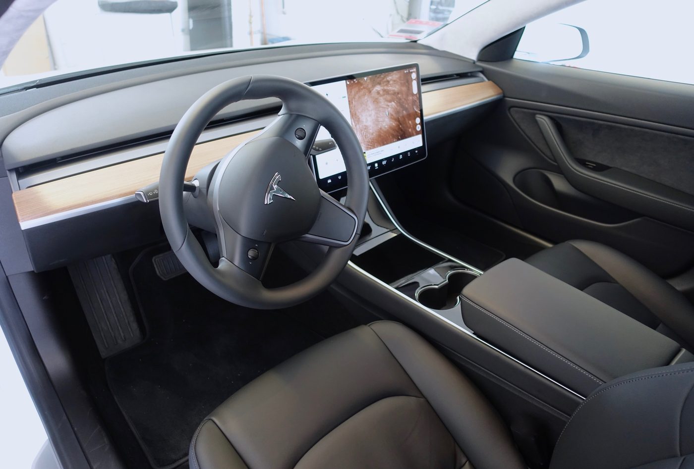 Tesla Model 3 dashboard — the central screen showing range and charge state