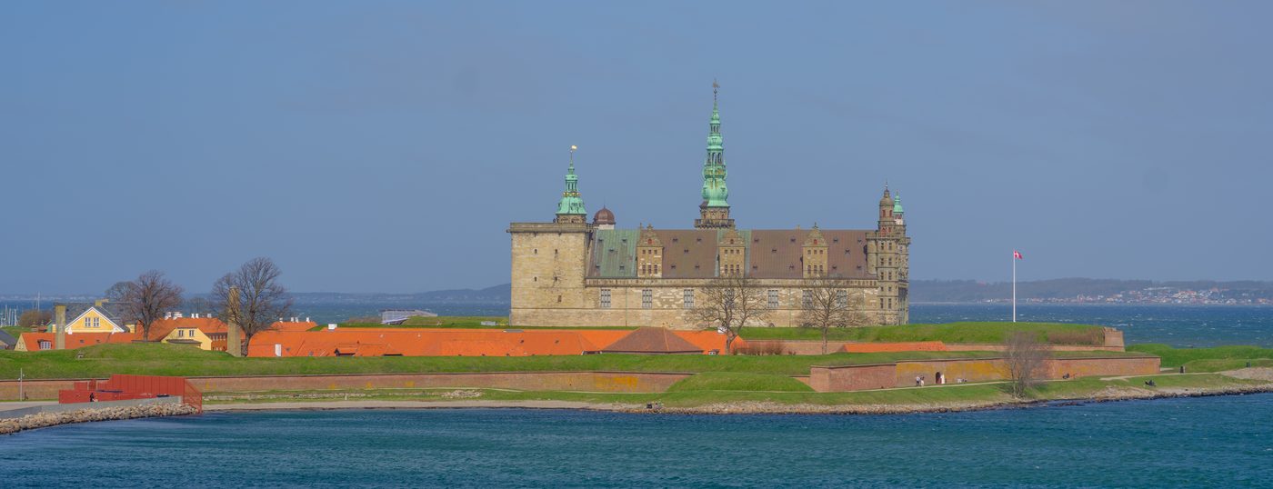 Kronborg Castle in Helsingør seen from the Øresund — the panoramic view passengers get from the ferry deck