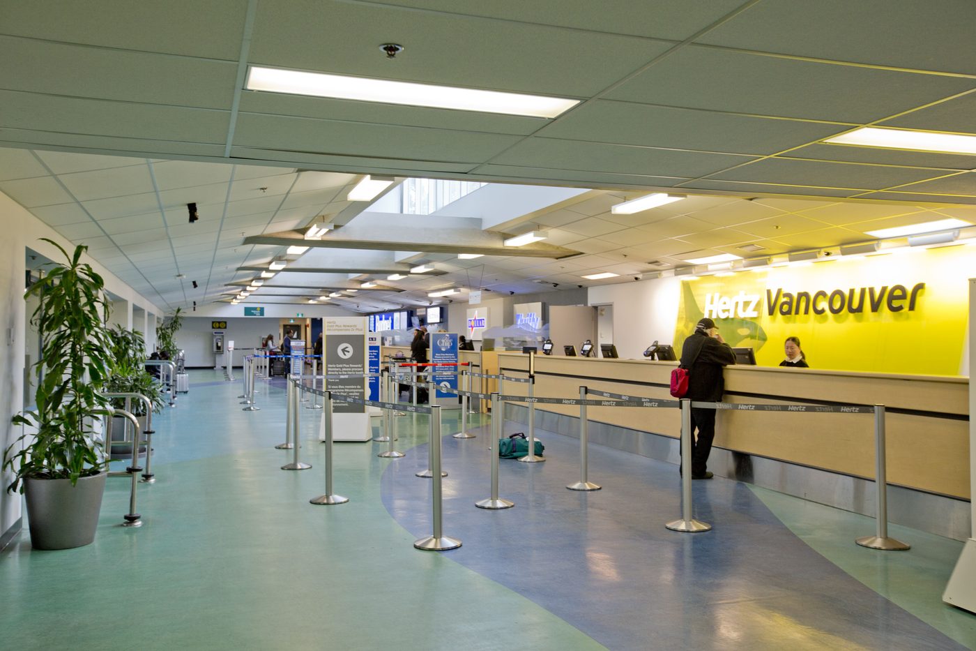 Major car rental counter at an international airport — the kind of setup you'll meet at Copenhagen Airport