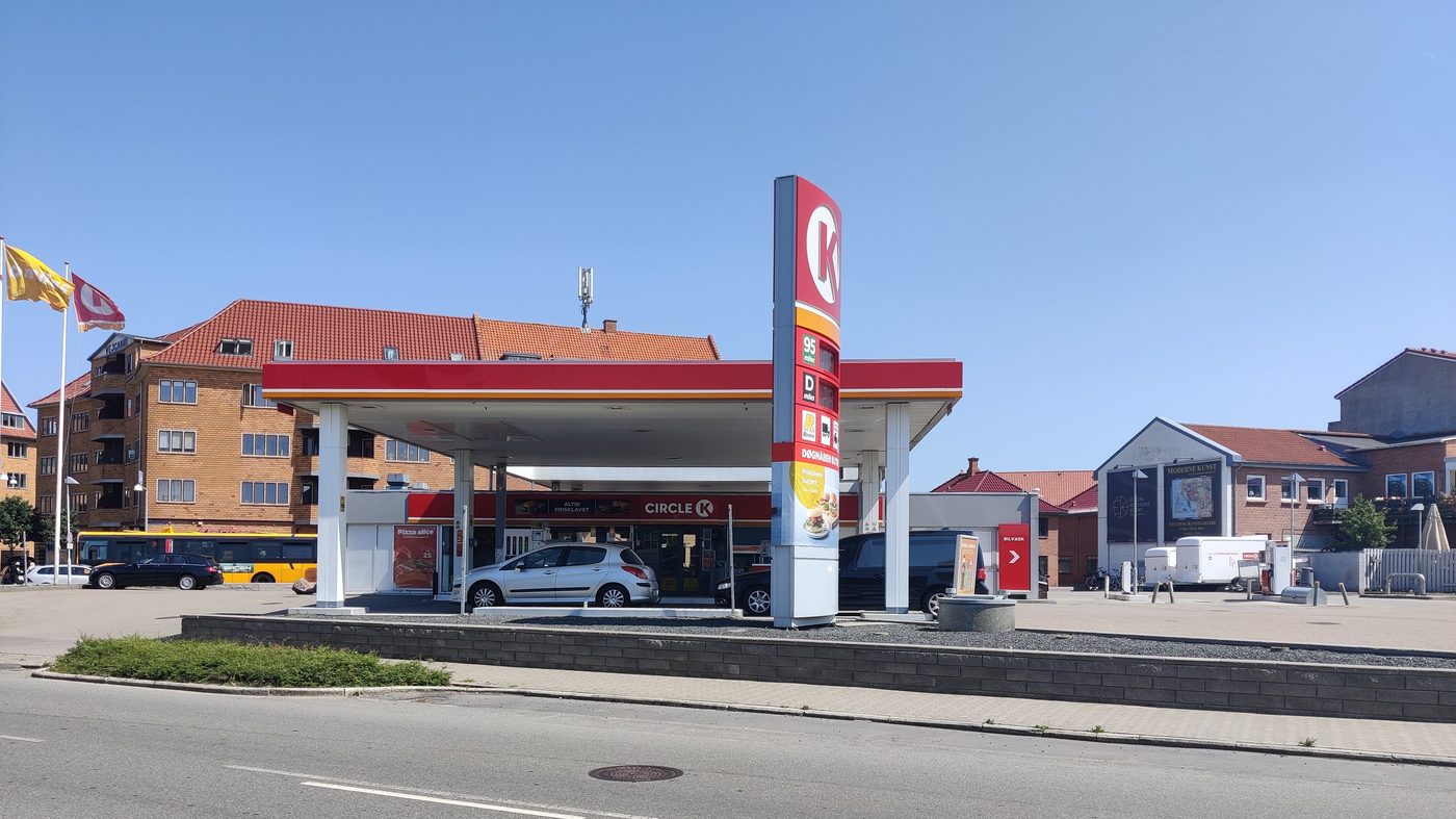 Circle K filling station on a Danish provincial street — the familiar red Circle K canopy, pump bays and convenience shop