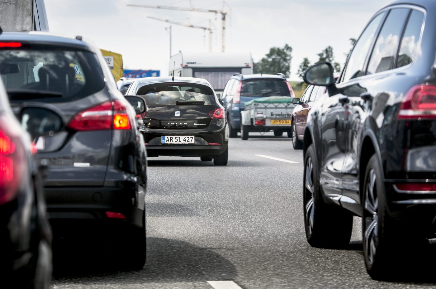 Danish motorway with the blue motorvej shield — the visual signal that 130 km/h is on the table