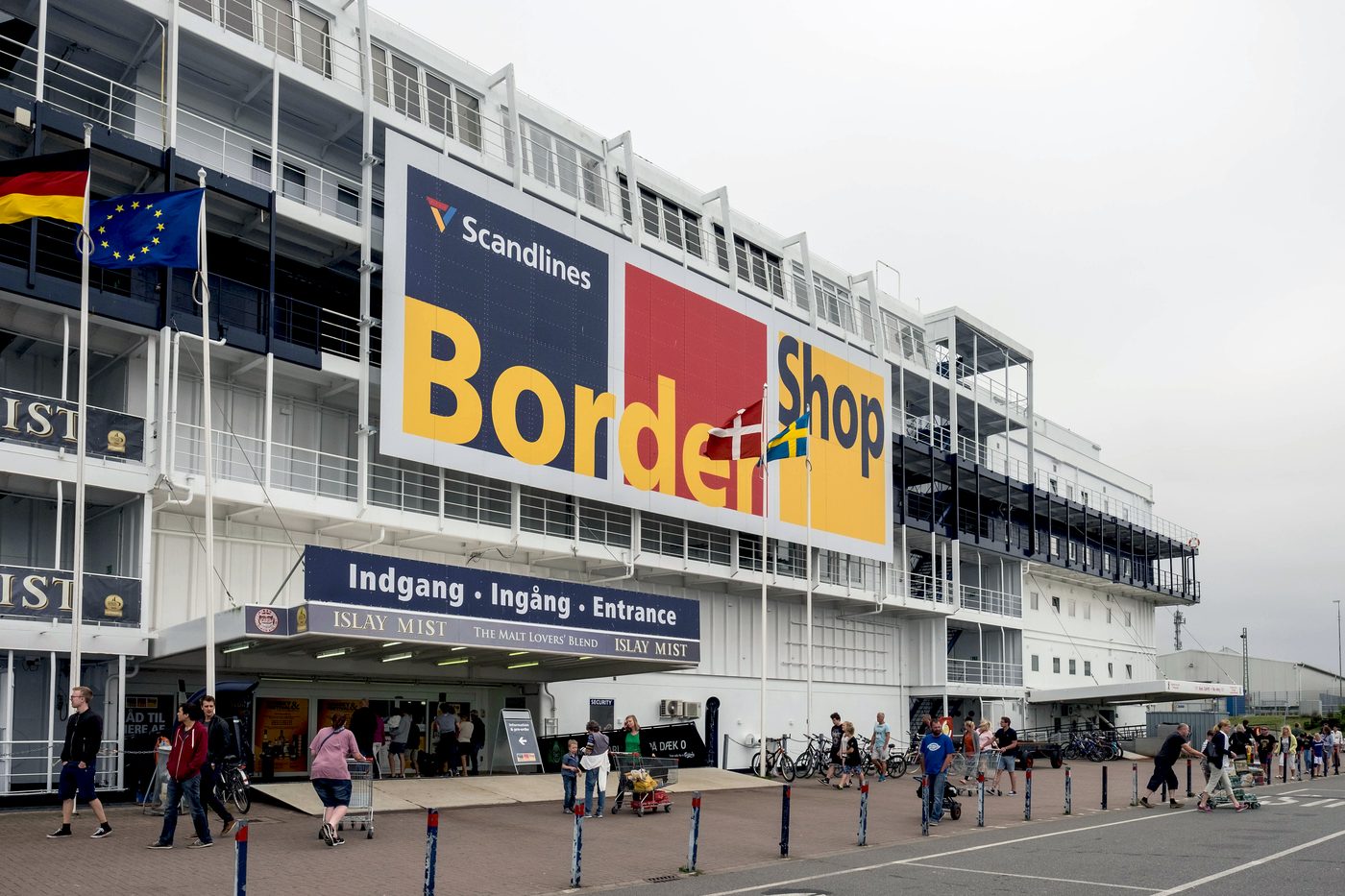 BorderShop Puttgarden interior — wall-to-wall beer cases, spirits and soft drinks aimed at Danish customers