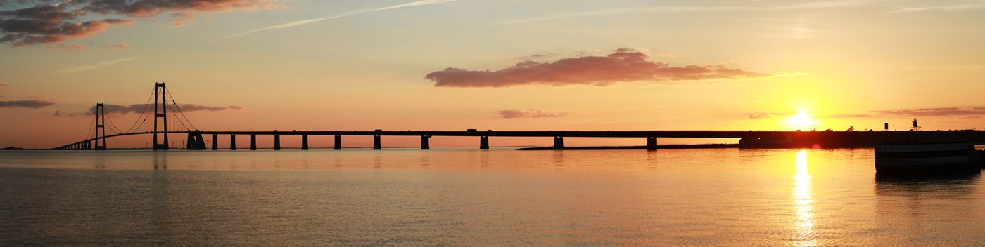 Storebælt fixed link panorama at golden hour — the bridge stretching across the Baltic strait